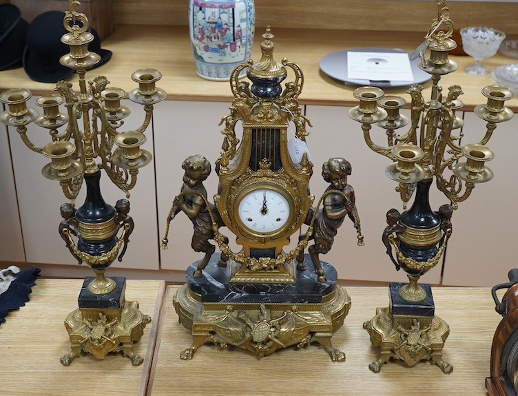 A bronze and marble three piece garniture, key, no pendulum, 69cm. Condition - good, not tested as working